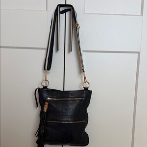 Sorial crossbody Ny leather bag with bamboo tassels.